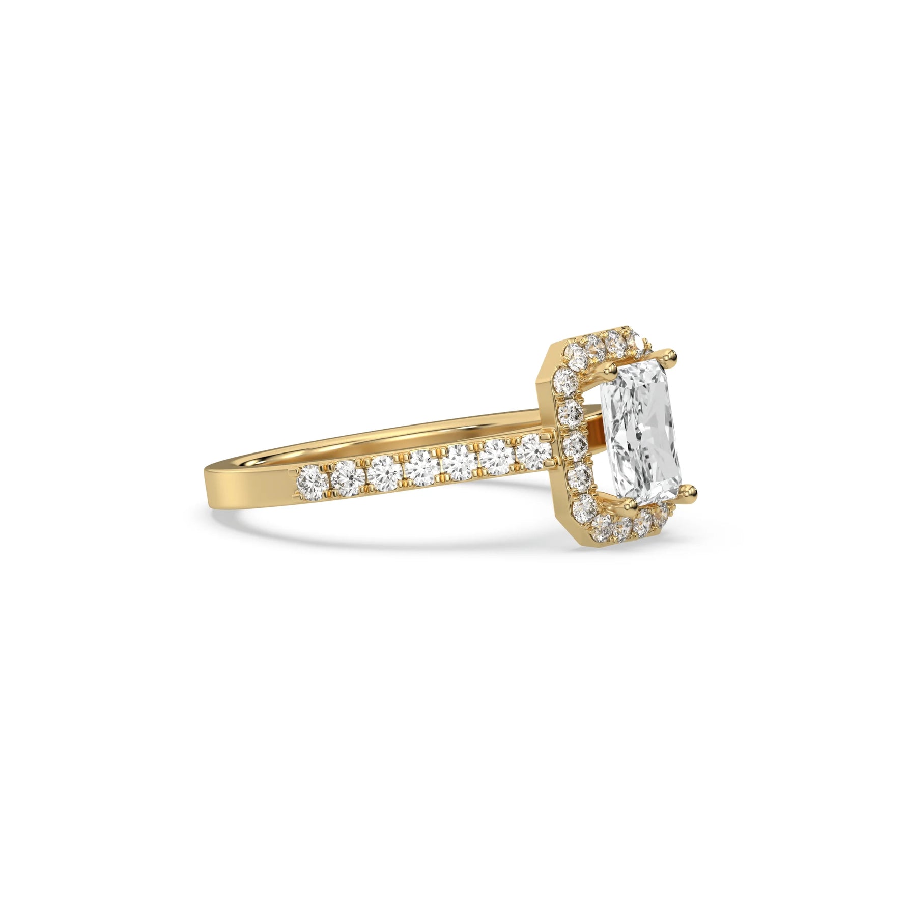 This yellow gold ring displayed in side view is made with a radiant solitaire diamond set in four-prong setting