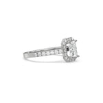 This white gold ring displayed in side view is made with a radiant solitaire diamond set in four-prong setting