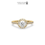 This yellow gold ring displayed in front view is made with a round solitaire diamond set in four-prong setting