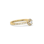 This yellow gold ring displayed in side view is made with a round solitaire diamond set in four-prong setting