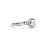 This white gold ring displayed in side view is made with a cushion solitaire diamond set in four-prong setting