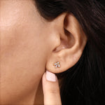 A yellow gold marquise fan diamond earring modeled on-ear to highlight the jewelry size, cluster arrangement, and everyday look.