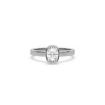 This white gold ring displayed on front view is made with cushion  solitaire diamond set in bezel setting