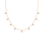 This rose gold Round Dangling Diamond Necklace made with nine round brilliant-cut diamond set in a prong setting, distributed evenly along the chain in top view