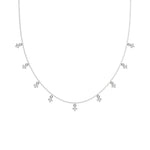 This white gold Round Dangling Diamond Necklace made with nine round brilliant-cut diamond set in a prong setting, distributed evenly along the chain in top view