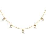 This yellow gold Round Dangling Diamond Necklace made with nine round brilliant-cut diamond set in a prong setting, distributed evenly along the chain in top view