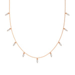 Marquise Dangling Diamond Necklace made with nine marquise cut diamonds each set in a prong setting, distributed evenly along the chain