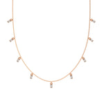 Oval Dangling Diamond Necklace made with nine oval cut diamonds each set in a prong setting, distributed evenly along the chain