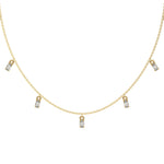 Oval Dangling Diamond Necklace made with nine oval cut diamonds each set in a prong setting, distributed evenly along the chain