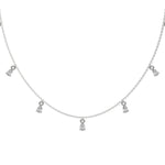 Pear Dangling Diamond Necklace made with nine pear cut diamonds each set in a prong setting, distributed evenly along the chain