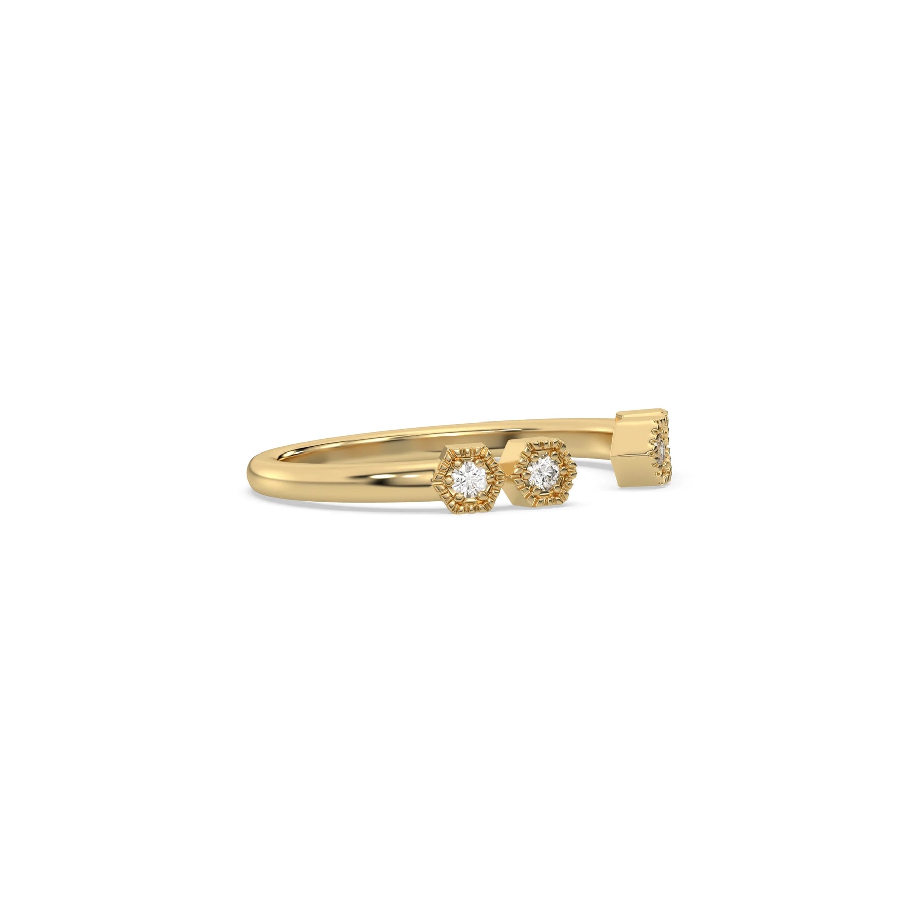 This yellow gold ring displayed on side view is made with round brilliant-cut diamonds with a gap in the middle. Each diamond is set in an hexagonal bezel with milgrain detailing on top 