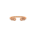 This rose gold ring displayed on front view is made with round brilliant-cut diamonds with a gap in the middle. Each diamond is set in an hexagonal bezel with milgrain detailing on top 