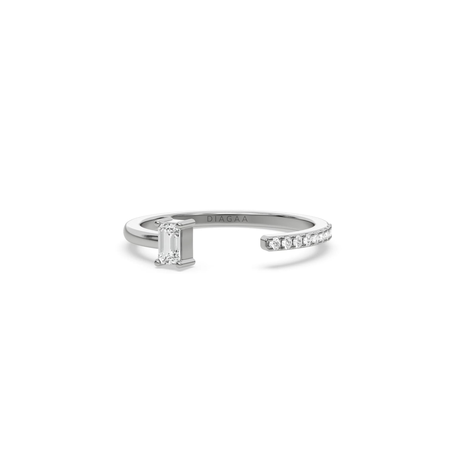 white gold open cuff ring with an emerald cut diamond and a round cut pave diamond band on a white background.