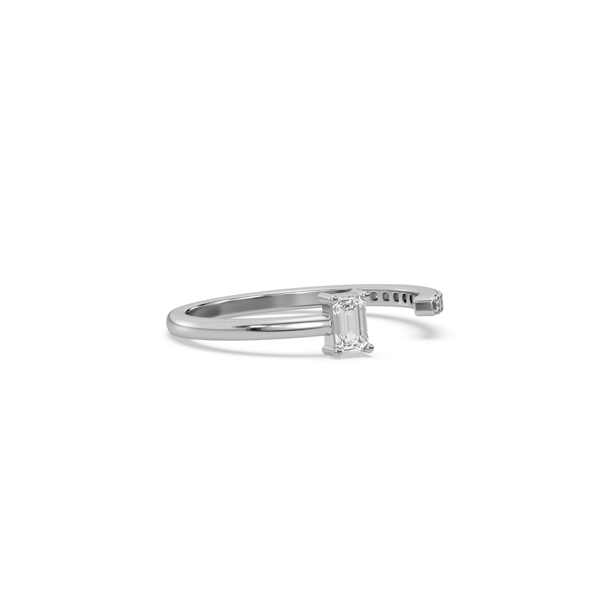 This white gold ring displayed on side view is made with emerald diamond and round diamond set in prong setting 