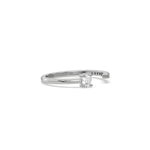 This white gold ring displayed on side view is made with emerald diamond and round diamond set in prong setting 