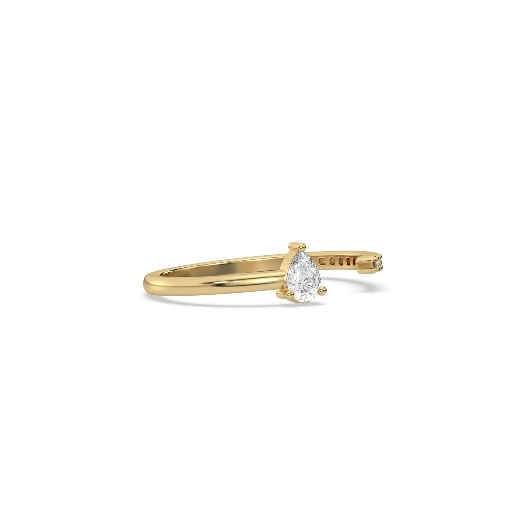 This yellow gold ring displayed on side view is made with pear diamond and round diamond set in prong setting 