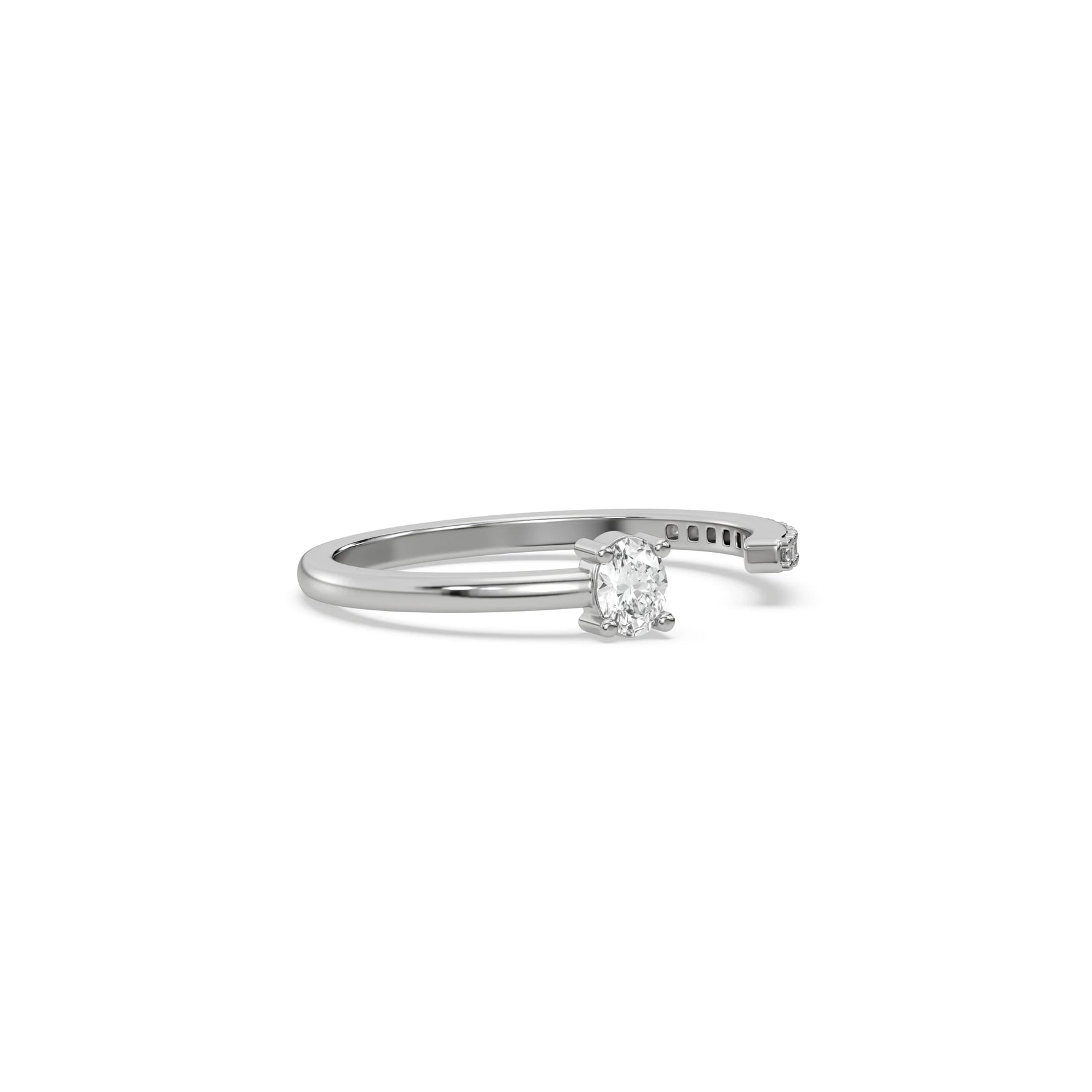 This white gold ring displayed on side view is made with oval diamond and round diamond set in prong setting 