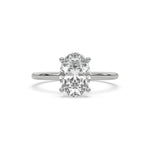 Oval diamond solitaire engagement ring featuring a hidden halo in sterling silver