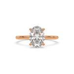 Hidden halo 14K rose gold engagement ring with an oval diamond solitaire ring