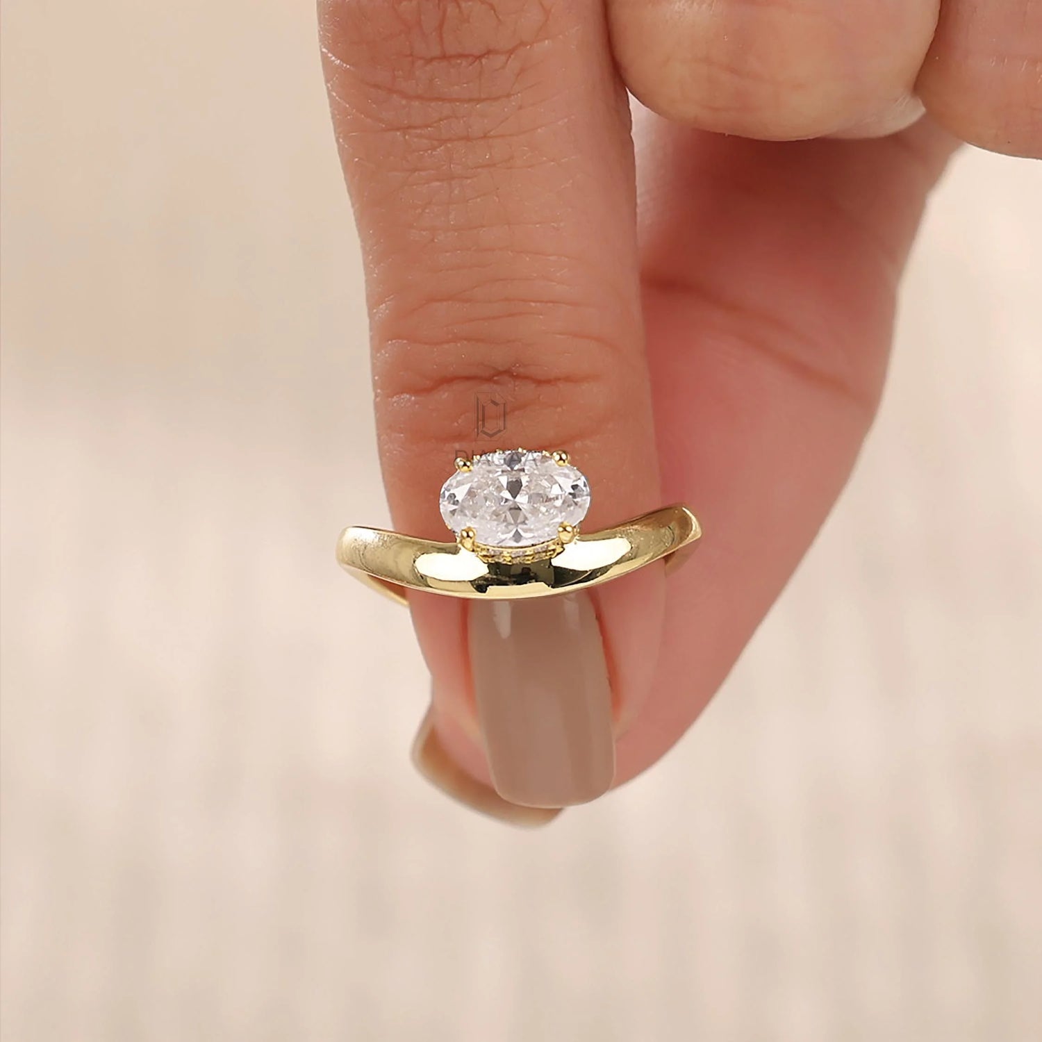10K yellow gold oval diamond hidden halo solitaire engagement ring with a curved band