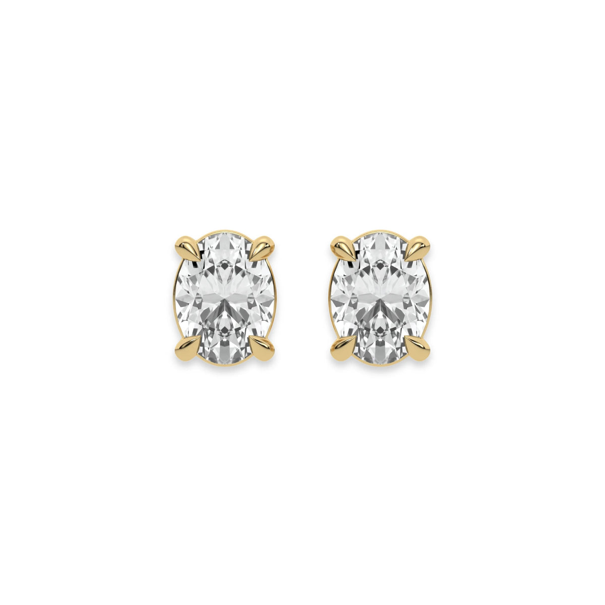 Sparkling oval diamond stud earring set showcasing brilliant-cut stones secured in a yellow gold prong setting.