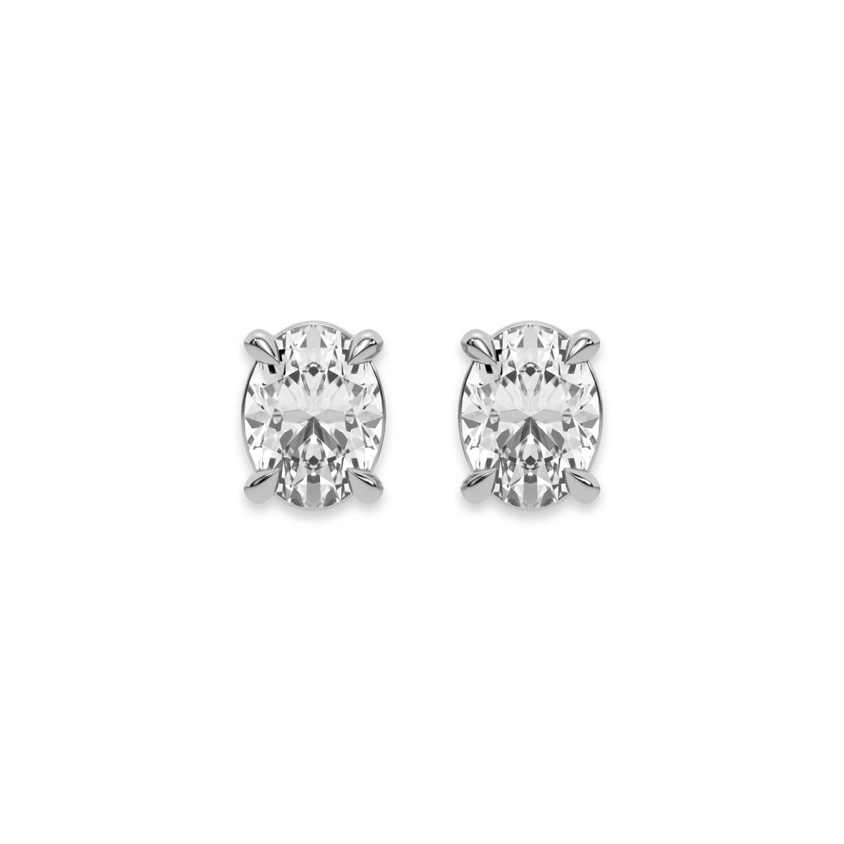 Sparkling oval diamond stud earring set showcasing brilliant-cut stones secured in a white gold prong setting.