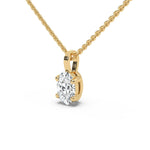 This yellow gold solitaire necklace featuring an oval diamond securely set in four prongs in side view