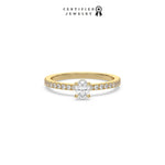 This yellow gold ring displayed in front view is made with a oval solitaire diamond set in four-prong setting