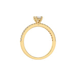 This yellow gold ring is made with an oval solitaire diamond set in four-prong setting, and is complemented by a round pave diamonds band in through finger view