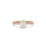 This rose gold ring displayed in front view is made with a oval solitaire diamond set in four-prong setting