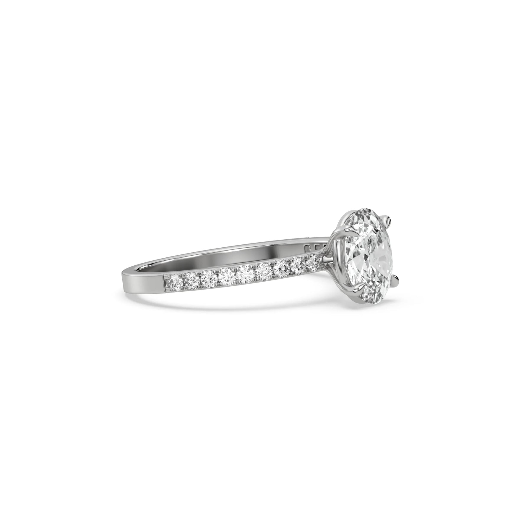 This white gold ring displayed in side view is made with a oval solitaire diamond set in four-prong setting