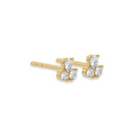 This yellow gold Trio Diamond Earrings made using two round brilliant-cut diamonds and a pear diamond, securely set in prong setting in side view