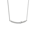 Curved Bar Diamond Necklace made with round brilliant-cut diamond in pave setting with a pear solitaire on top set at an angle with adjustable chain