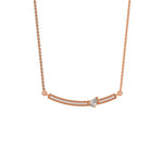 Curved Bar Diamond Necklace made with round brilliant-cut diamond in pave setting with a pear solitaire on top set at an angle with adjustable chain