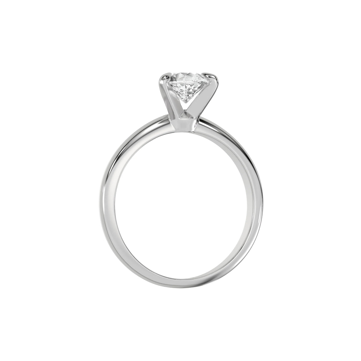 This white gold ring features a pear solitaire diamond elegantly secured in a three-prong setting on a solid gold band in through finger view