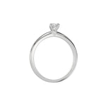 This white gold ring features a pear solitaire diamond elegantly secured in a three-prong setting on a solid gold band in through finger view