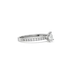 This white gold ring displayed in side view is made with a Pear solitaire diamond set in four-prong setting