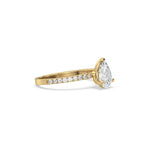 This yellow gold ring displayed in side view is made with a Pear solitaire diamond set in four-prong setting