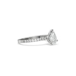 This white gold ring displayed in side view is made with a Pear solitaire diamond set in four-prong setting