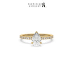 This yellow gold ring displayed in front view is made with a Pear solitaire diamond set in four-prong setting