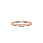 This rose gold A thin gold band showcases a baguette diamond held in a bar prong setting in top view