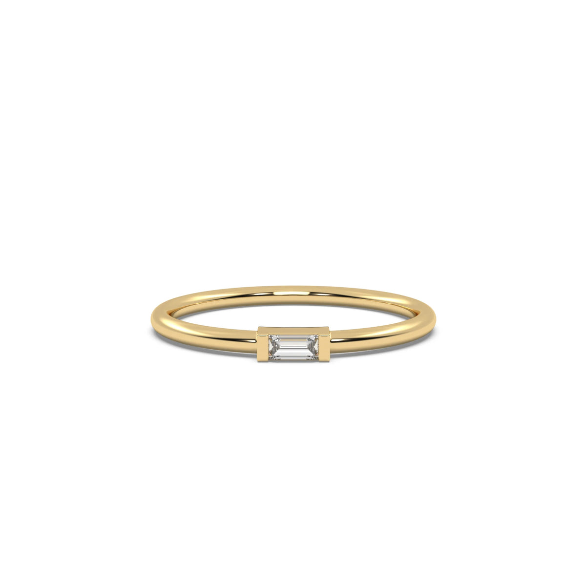 This yellow gold A thin gold band showcases a baguette diamond held in a bar prong setting in top view