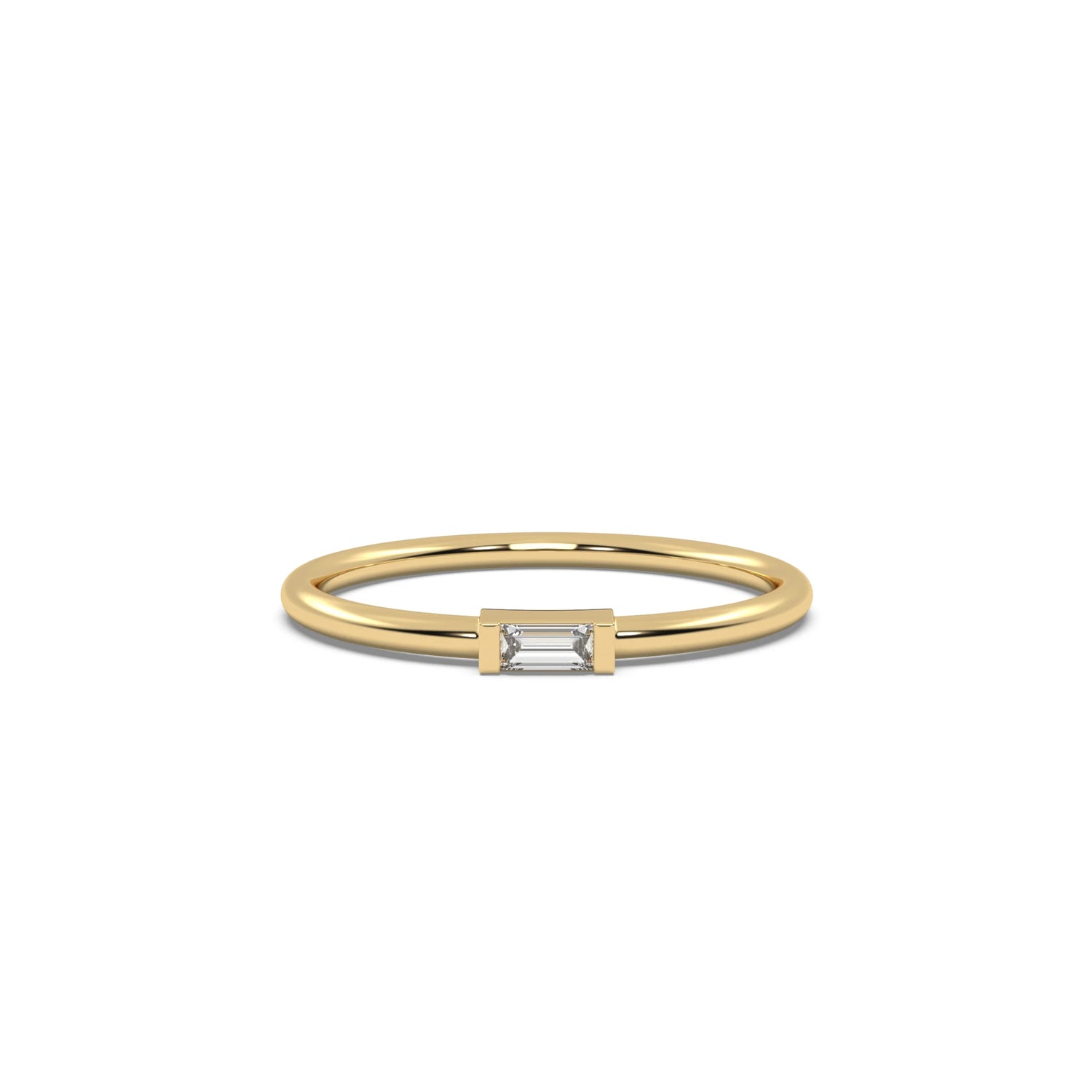 This yellow gold A thin gold band showcases a baguette diamond held in a bar prong setting in top view