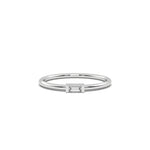 This white gold A thin gold band showcases a baguette diamond held in a bar prong setting in top view