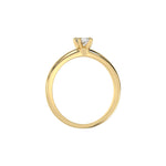 This yellow gold ring features a cushion solitaire diamond elegantly secured in a four-prong setting on a solid gold band in through finger view