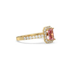 This yellow gold ring displayed in side view is made with a radiant solitaire diamond set in four-prong setting