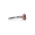 This white gold ring displayed in side view is made with a oval solitaire diamond set in four-prong setting