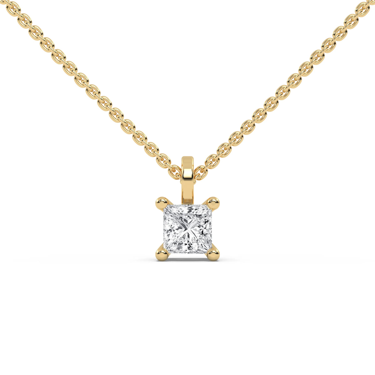 A classic princess diamond necklace featuring a sparkling solitaire pendant. This elegant prong-set design is beautifully crafted in polished yellow gold on a delicate chain.