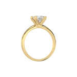 This yellow gold ring features a princess solitaire diamond elegantly secured in a four-prong setting on a solid gold band in through finger view