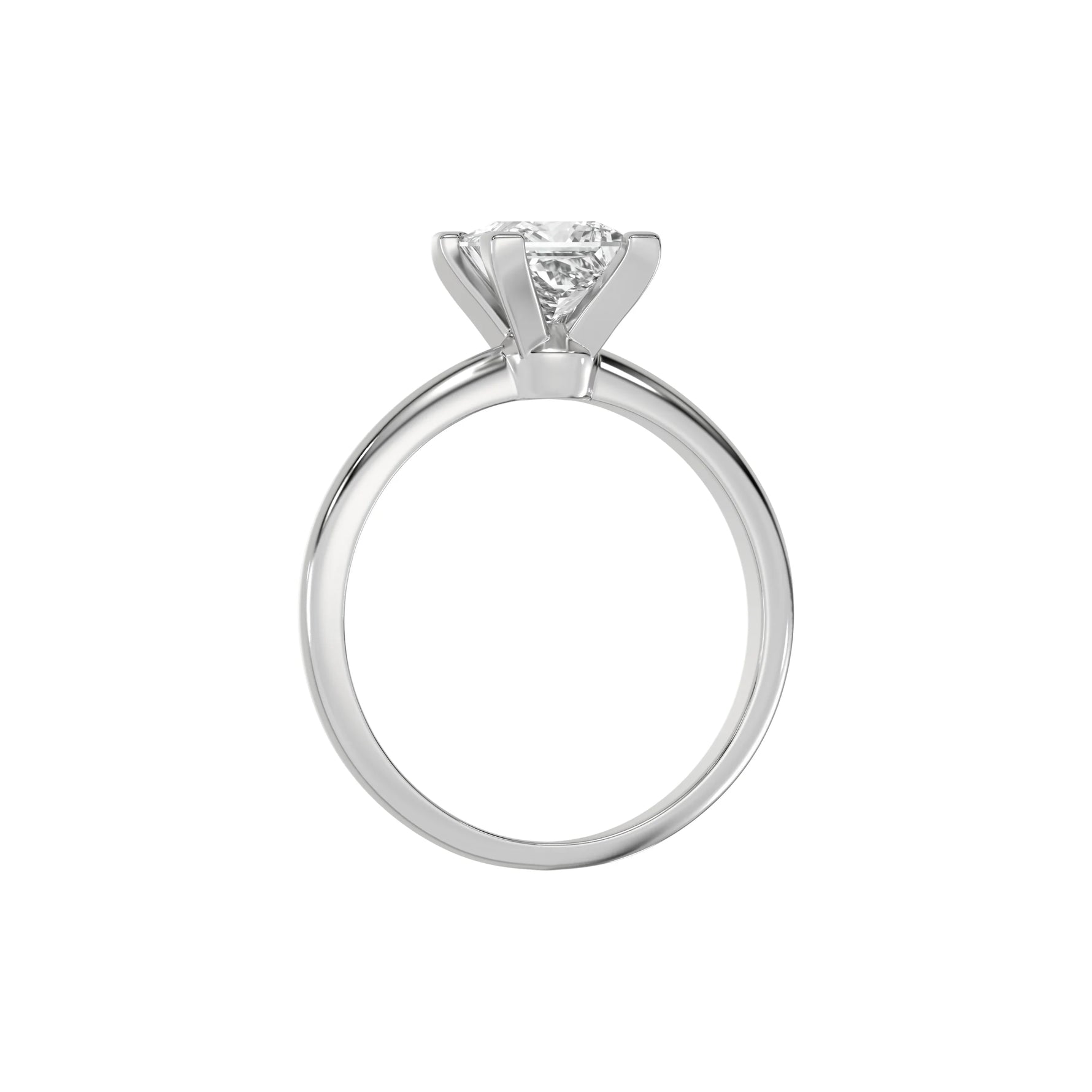 This white gold ring features a princess solitaire diamond elegantly secured in a four-prong setting on a solid gold band in through finger view